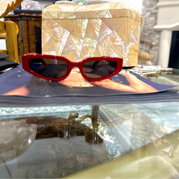 The product is a pair of Celine Paris sunglasses in a striking red - Picture 1 of 4